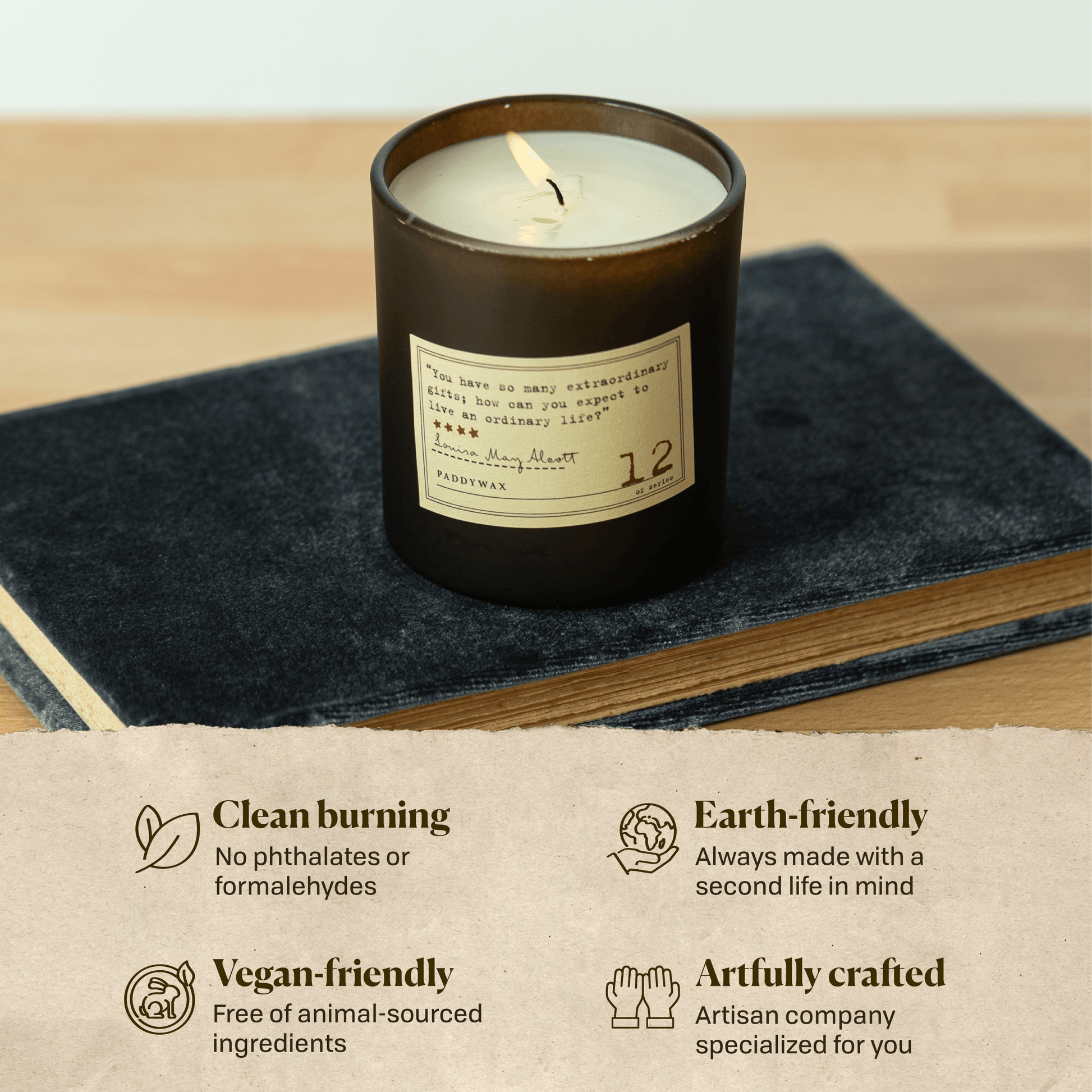 A photo of the Louisa May Alcott candle sitting on a book. Clean burning: no phthalates or formaldehydes. Earth-friendly: Always made with a second life in mind. Vegan-friendly: Free of animal sourced ingredients. Artfully crafted: Artisan company specialized for you.