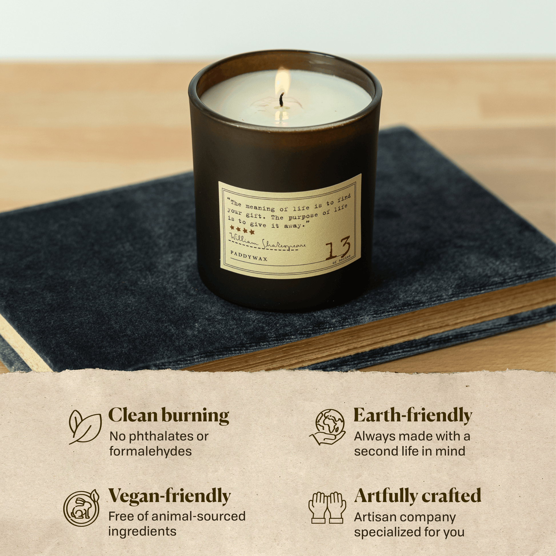 A photo of the William Shakespeare candle sitting on a book. Clean burning: no phthalates or formaldehydes. Earth-friendly: Always made with a second life in mind. Vegan-friendly: Free of animal sourced ingredients. Artfully crafted: Artisan company specialized for you.