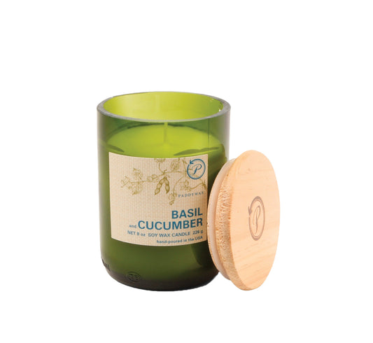 Candle in an 8 oz green glass vessel with a beige label and a wooden lid