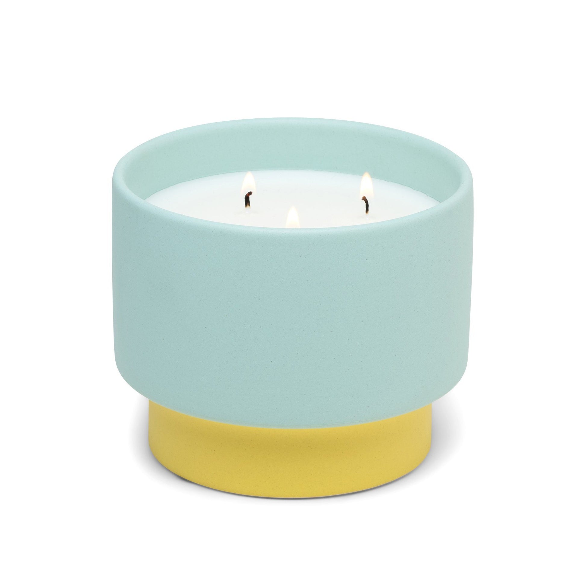16 oz ceramic vessel from the Color Block collection; turquoise upper section and yellow lower section; white wax and three cotton wicks