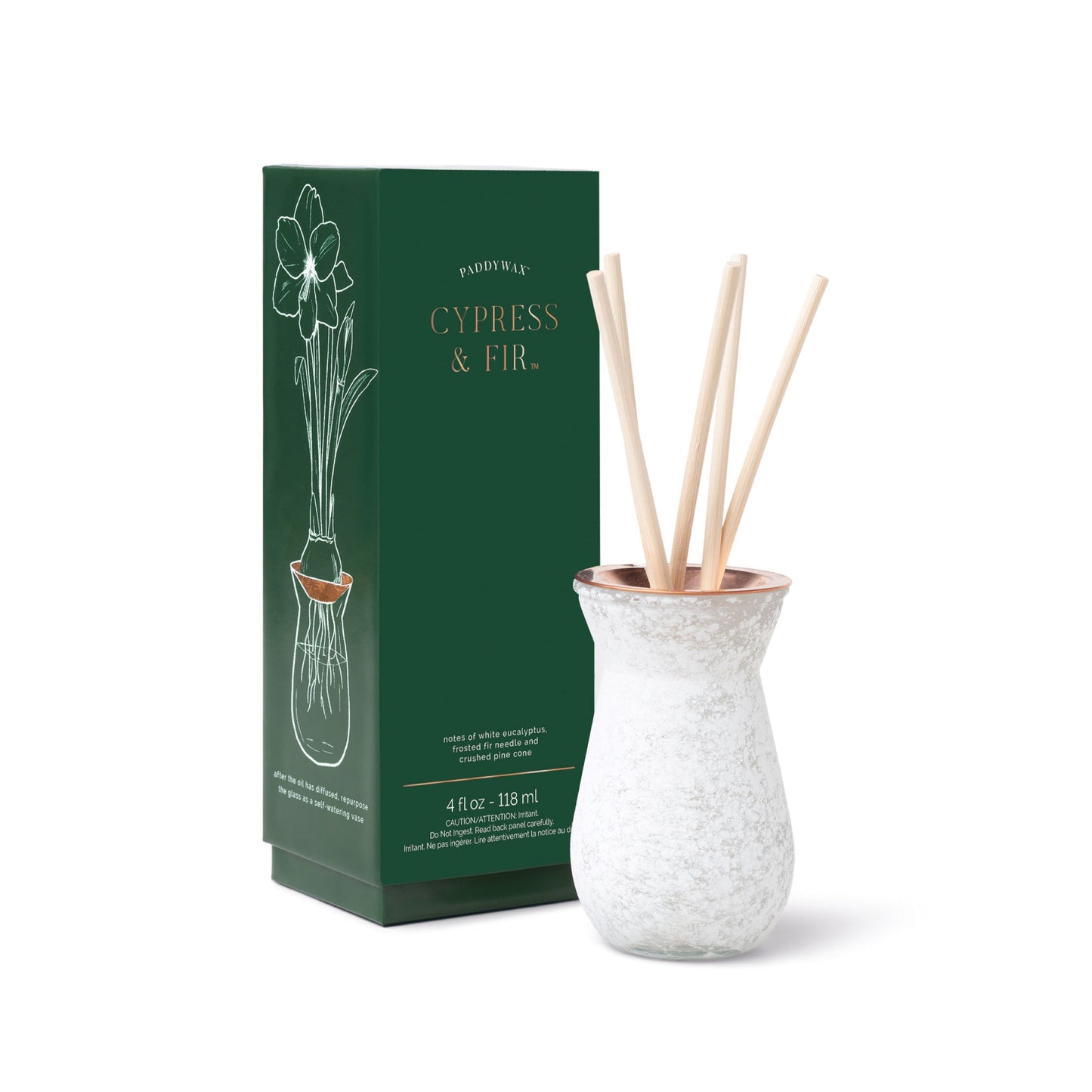 4 oz White Dusted Flora Bulb Diffuser pictured with sticks in it in front of the green box
