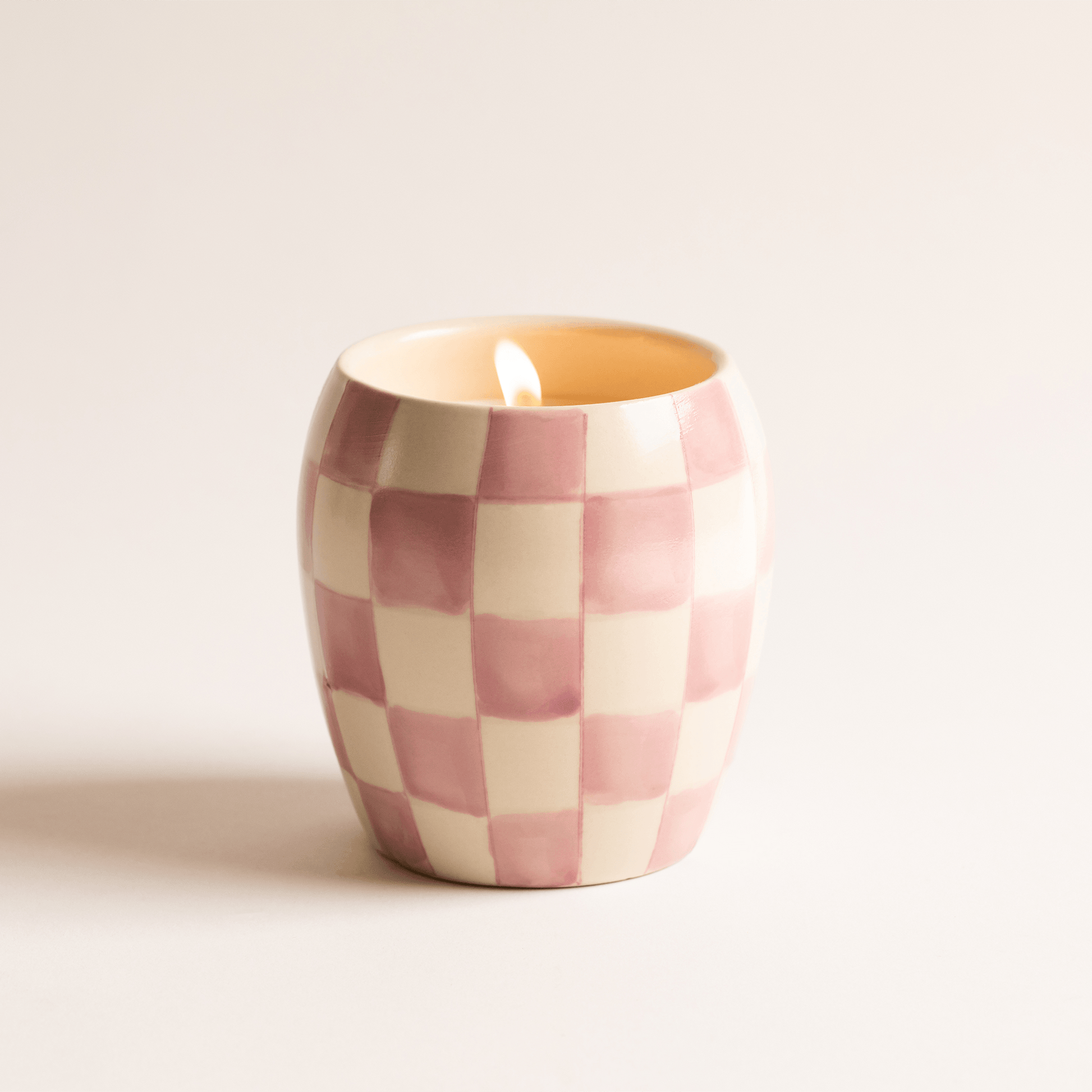 11 oz ceramic vessel with rounded cylindrical shape and a light purple and white checker design; one cotton wick