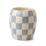The Cotton + Teak - Checkmate Candle 11 oz features a blue and white checkerboard ceramic cup, ideal for reusable decor or as a stylish hand-painted vessel for checkerboard candles.