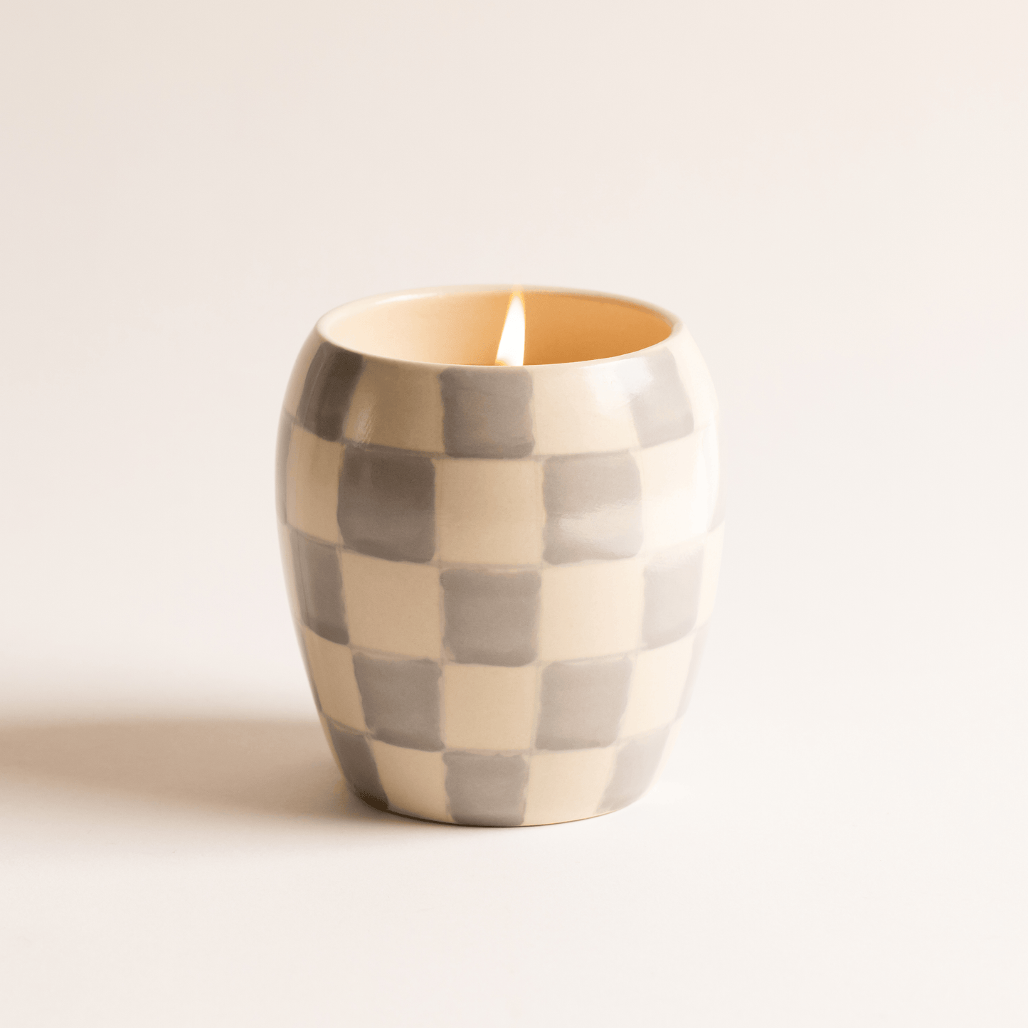 11 oz ceramic vessel with rounded cylindrical shape and a light blue and white checker design; one cotton wick