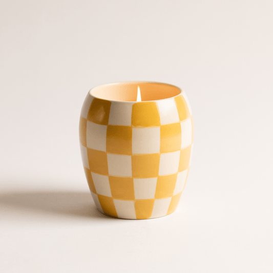 11 oz ceramic vessel with rounded cylindrical shape and a yellow and white checker design; one cotton wick