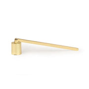 gold-colored brass candle snuffer