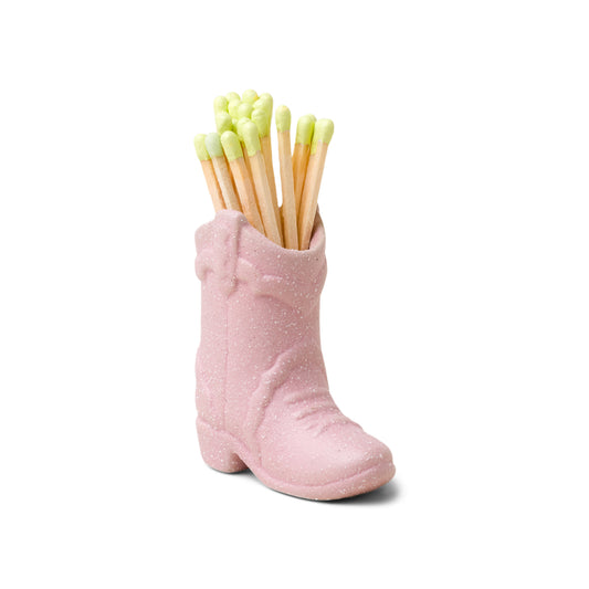 small pink ceramic cowboy boot pictured holding green-tipped matches