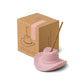 Pink ceramic cowboy hat holding incense stick in the top; pictured in front of brown packaging