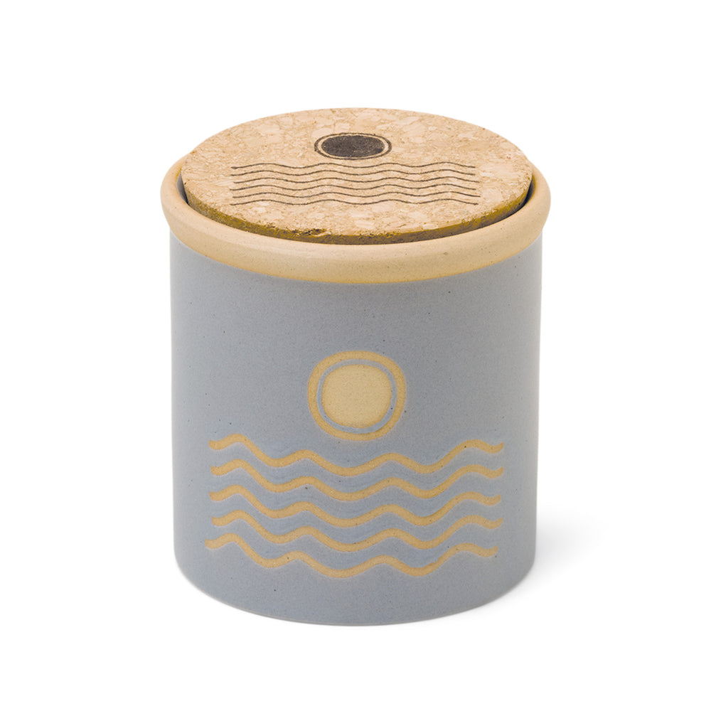 8 oz blue ceramic vessel with ocean design and a cork lid (also containing the same design)