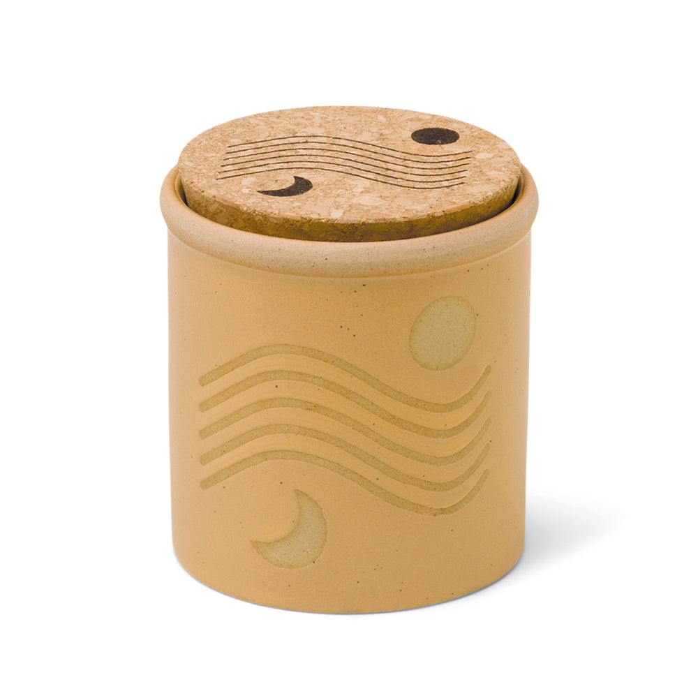 8 oz yellow ceramic vessel with sun/moon design and a cork lid (also containing the same design)
