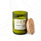 Candle in an 8 oz green glass vessel with a beige label and a wooden lid