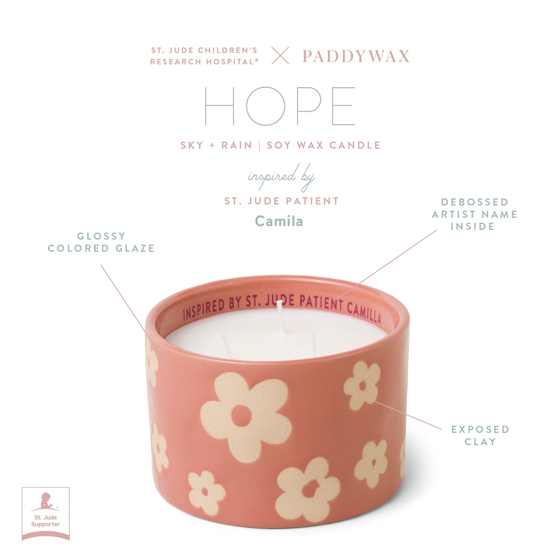 Infographic of pink ceramic candle with product features text "St. Jude Children's Research Hospital ® x Paddywax Hope Sky + Rain Soy Wax Candle inspired by St. Jude Patient Camila. Glossy colored glazed. Debossed artist name inside. Exposed clay."