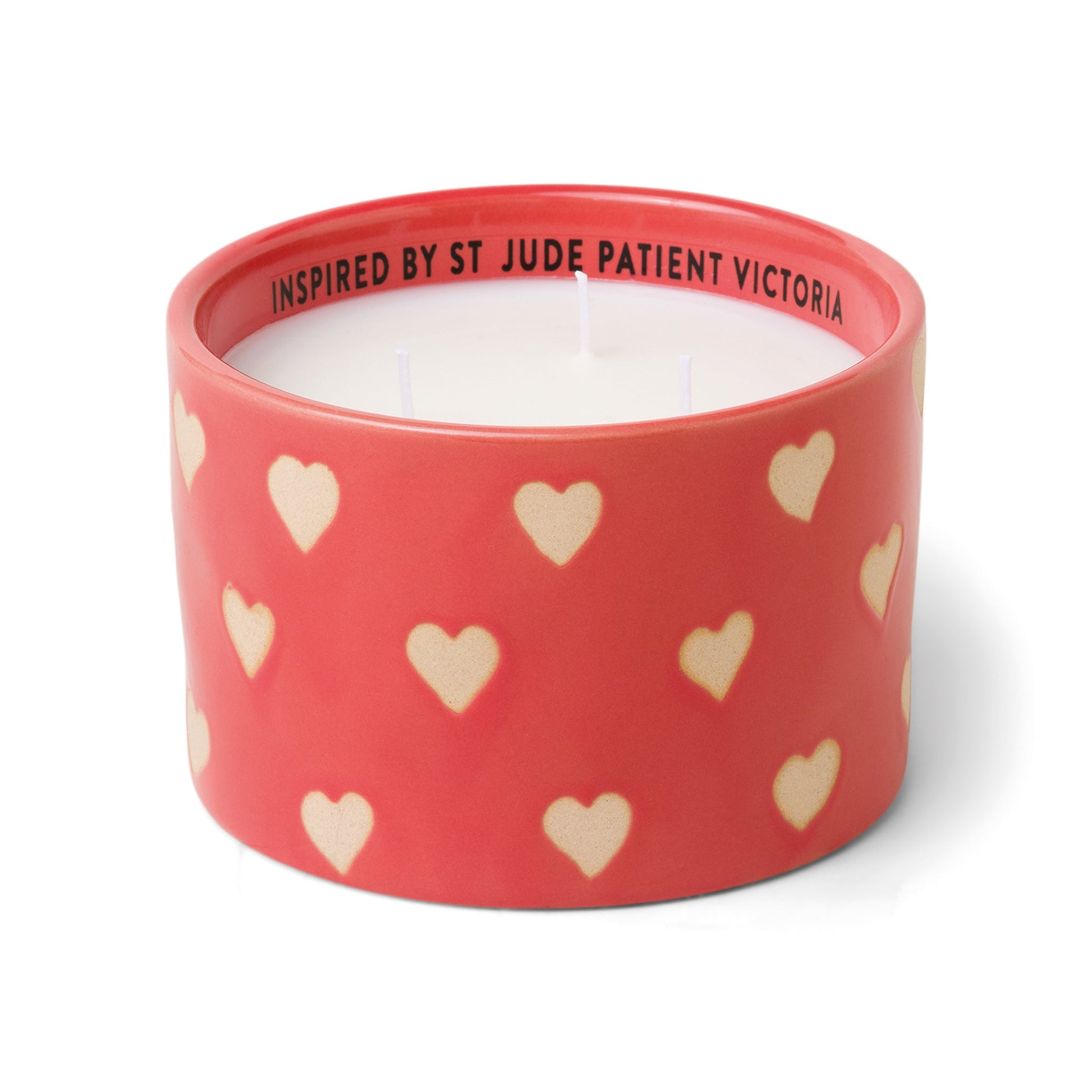 Red ceramic candle with hearts and white soy wax center with three wicks. Debossed name on back side of the label with text "Inspired by St. Jude patient Victoria". Scented candle on white background