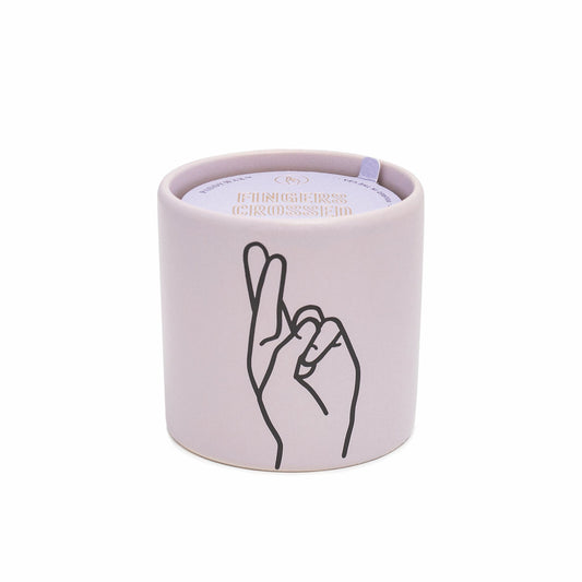 Impressions 5.75 oz Candle - Wisteria + Willow "Fingers Crossed" - purple colored vessel with black outlined hand with fingers crossed