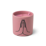 The Violet Vanilla "Thankful For You" 5.75 oz candle is a pink ceramic cup with a black graphic of two hands in prayer—making it a thoughtful gift choice.