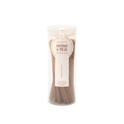 Clear glass cylinder holding 100 incense sticks for flameless fragrance.