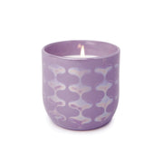 The Lavender & Fern - Lustre Candle 10 oz comes in a purple ceramic container with a wavy, iridescent pattern, bringing elegance and charm to any space.