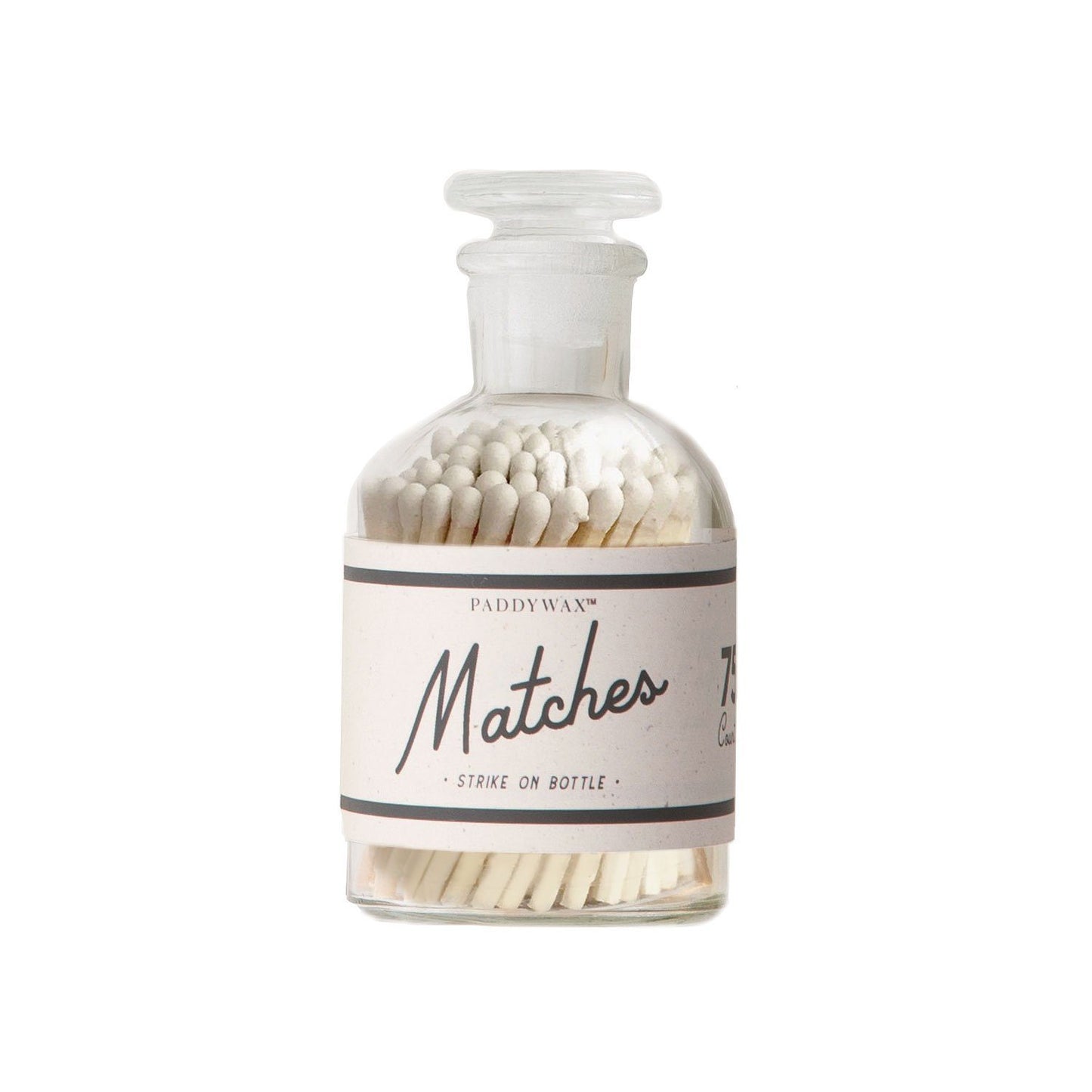 clear glass apothecary-style bottle with white matches label; white matches inside
