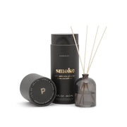 The Smoke - 1.5 oz Diffuser features sleek black design with reeds, ideal for adding elegance and a sophisticated fragrance to any space.