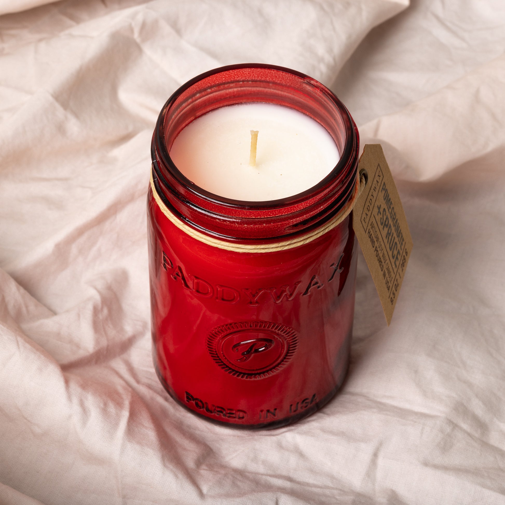 Pomegranate Relish Candle shown from the top with the single wick