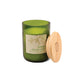 Candle in an 8 oz green glass vessel with a beige label and a wooden lid