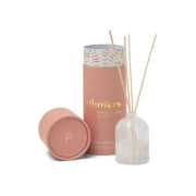 The Flowers - 1.5 oz Diffuser features a pink cylindrical container and a milky glass bottle with arranged wooden reeds—an elegant gift that adds fragrance and style to any space.